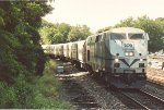 Outbound commuter approaches the station to makes its stop
